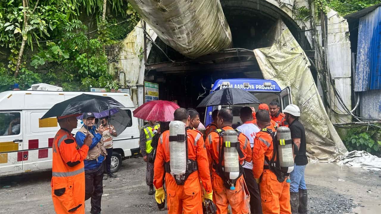 Toxic gas slows efforts to rescue 13 workers trapped in India hydropower tunnel