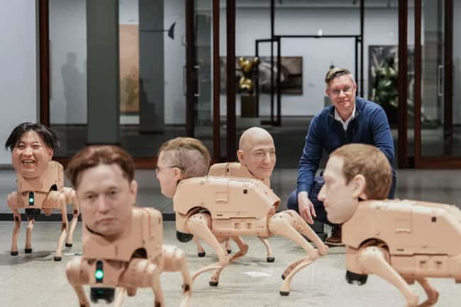 Robot dogs with Musk and Zuckerberg heads roam around Berlin museum in Beeple’s new exhibit