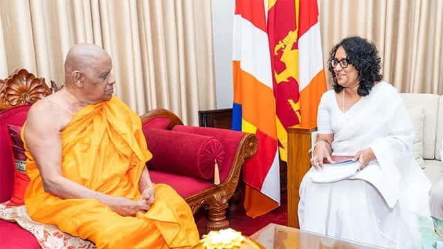 PM presents revised national curriculum framework to Mahanayake Theros