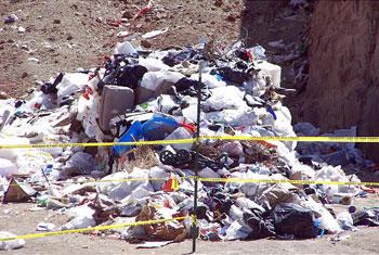 Infant’s body found among trash 