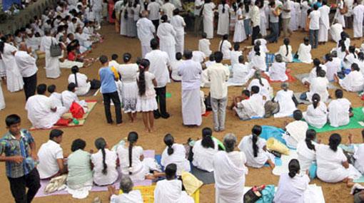 UPFA candidate’s cards distributed with ‘Pirith’ books at temple