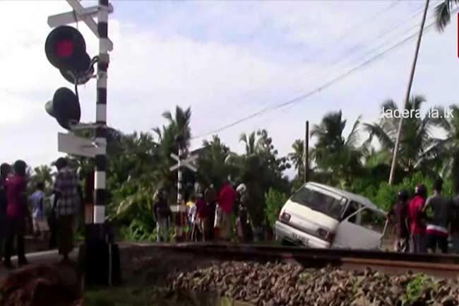 Train collides with van at railway crossing