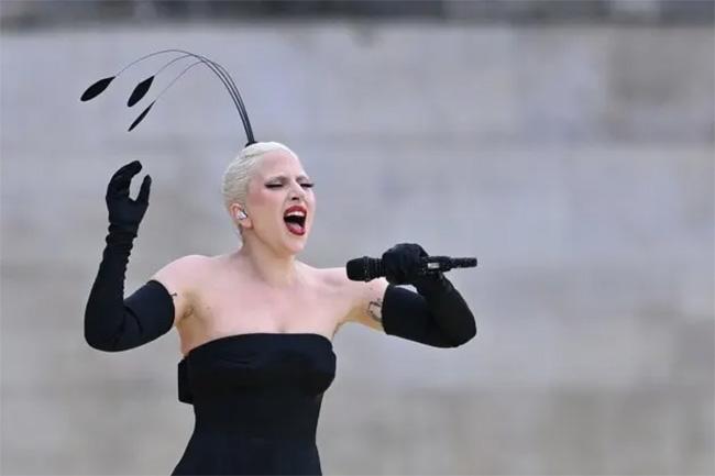 Lady Gaga speaks after Olympics ceremony performance plagued by sound issues and dancer falling off-stage