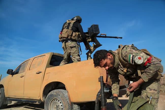 Iraqi fighters head to Syria to battle rebels but Lebanon’s Hezbollah stays out, sources say