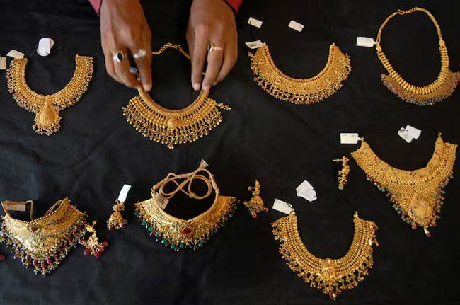 Gold builds on historic rally, soars past $4,000 an ounce for first time