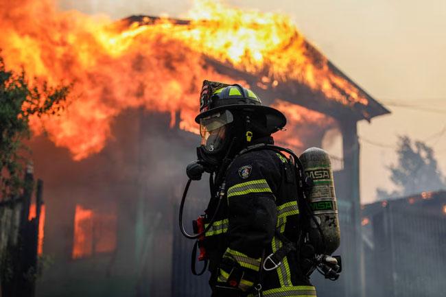 Chile fires kill at least 18 as firefighters battle extreme heat, winds