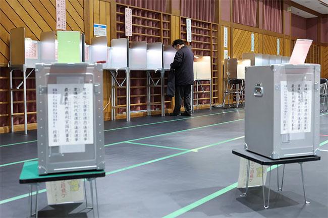 Japan’s governing party projected to win snap election majority