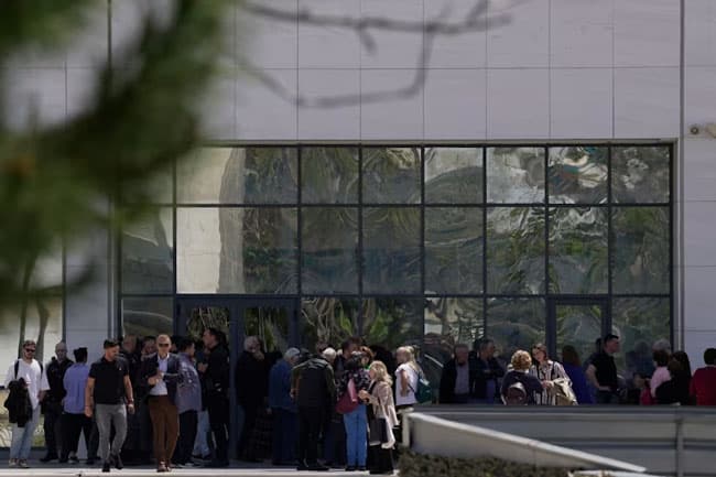 Gunman opens fire at 2 locations in the Greek capital, leaving several wounded