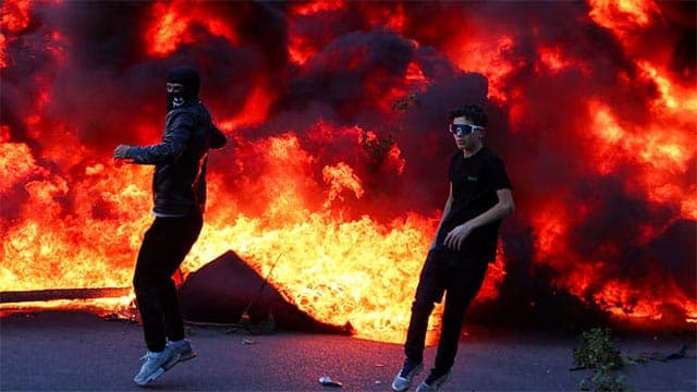 Banks, buildings burn as Albania's capital Tirana erupts into student violence