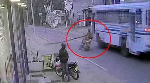 CCTV: Motorcyclist carrying bamboo pole run-over by bus