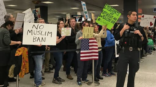 Federal judge temporarily blocks Trump travel ban
