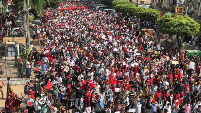 Myanmar coup: Police use water cannon as thousands strike