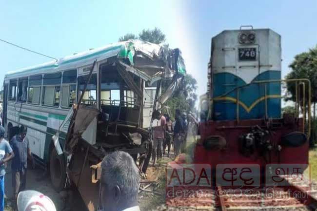 One dead, several injured as train hits bus in Talaimannar