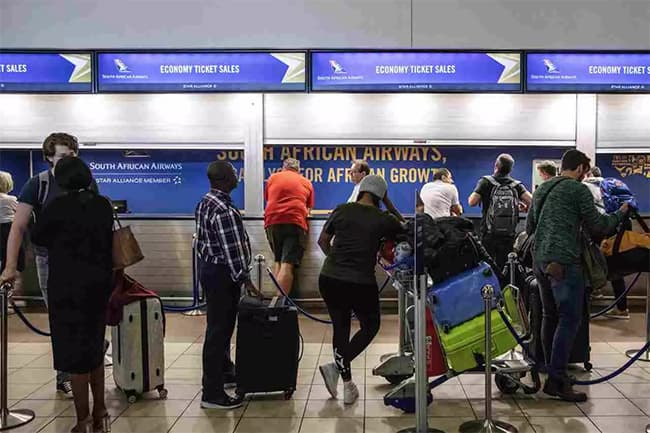 Global worry over new COVID variant triggers South Africa travel curbs