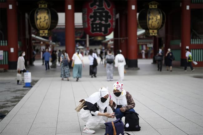 Japan eases foreign tourism ban, allows guided package tours