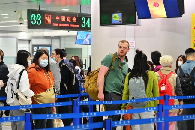 China to fully reopen borders to foreigners but near-term hurdles remain