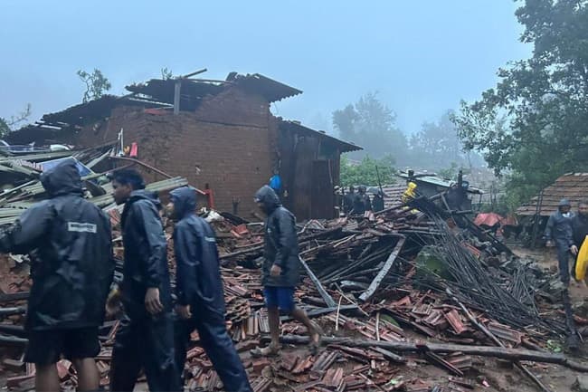 Ten dead, more than a 100 feared trapped in landslide in India after heavy rain