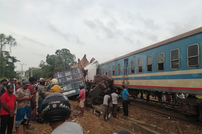Railway operations disrupted as container truck collides with train