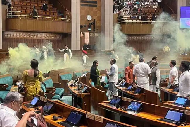 Major security breach inside Indian parliament, two enter Lok Sabha and hurl gas canisters