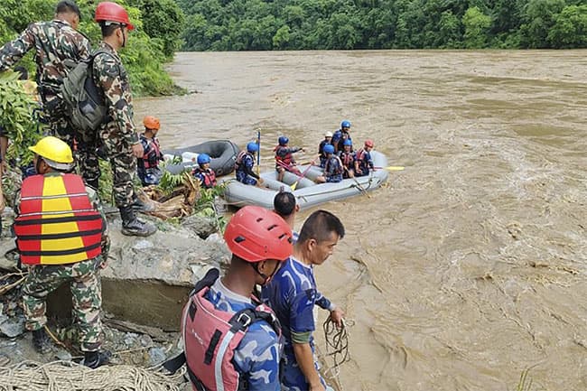 2 buses carrying at least 60 swept into river by landslide in Nepal