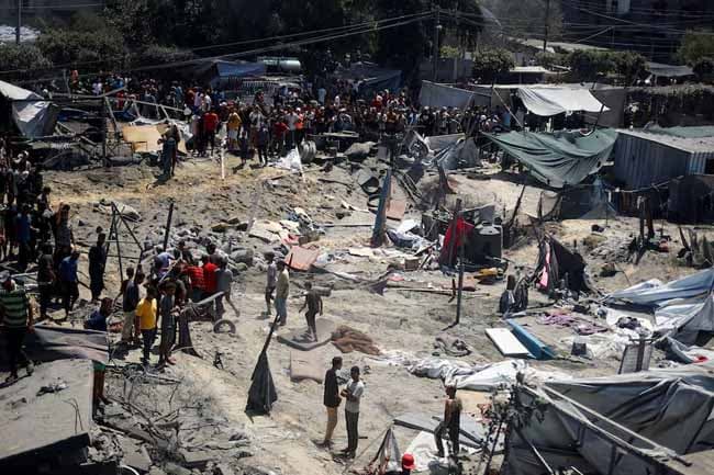 At least 71 Palestinians killed, Gaza officials say, as Israel targets Hamas military chief