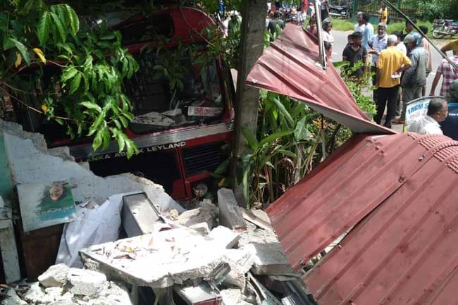 Two killed after bus veers off road and crashes into shop