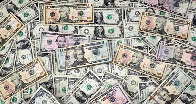 Dollar climbs at end of wild week on signs of easing in US-China trade tensions