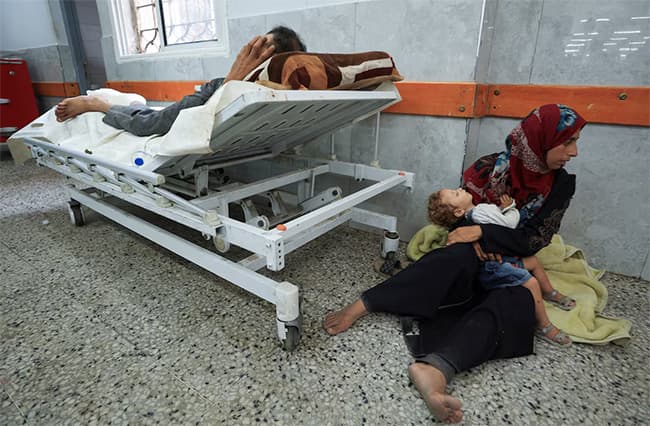 Israeli fire kills 60 in Gaza, many near aid site, medics say