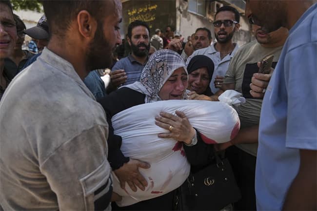 Officials say 85 Palestinians seeking aid are killed in Gaza as Israel widens evacuation orders