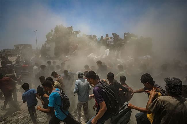 Hamas says it will allow aid for hostages if Israel halts airstrikes, opens permanent humanitarian corridors