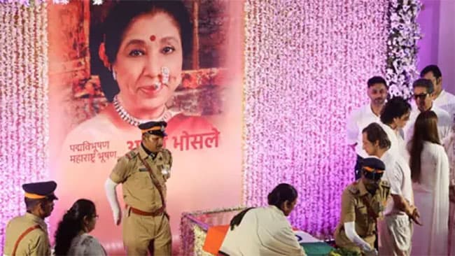 Mourners sing Asha Bhosle hit as iconic Indian singer cremated