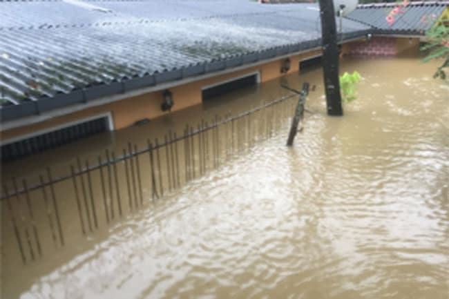 Mudslide and flood death toll rises
