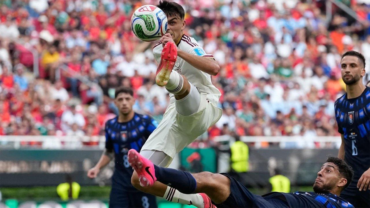 Spain wins its World Cup group, beating Uruguay 1-0 to send 2-time champion home