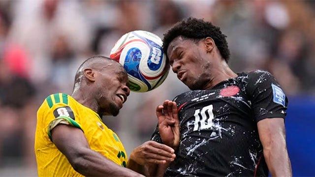 Canada score late winner against South Africa to advance to last 16 at World Cup