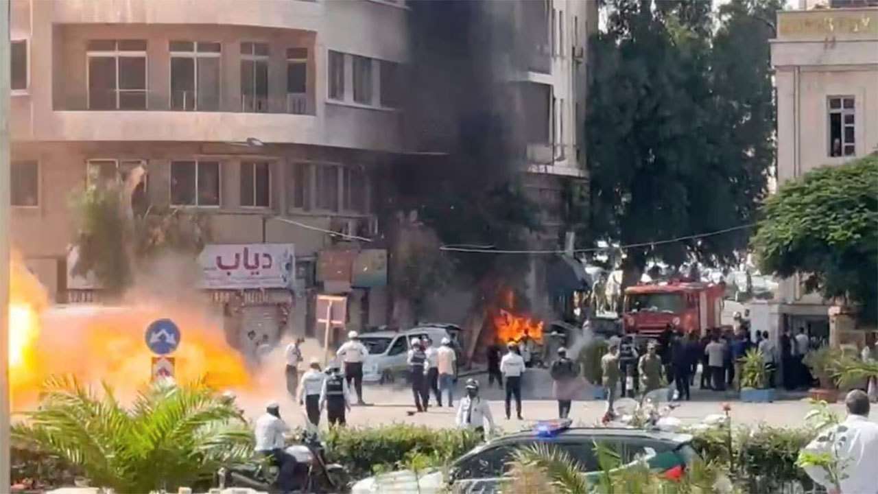 Explosions heard in Damascus during Macron visit, security source says