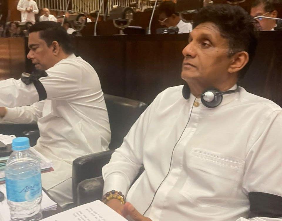 Opposition MPs protest in parliament wearing black armbands