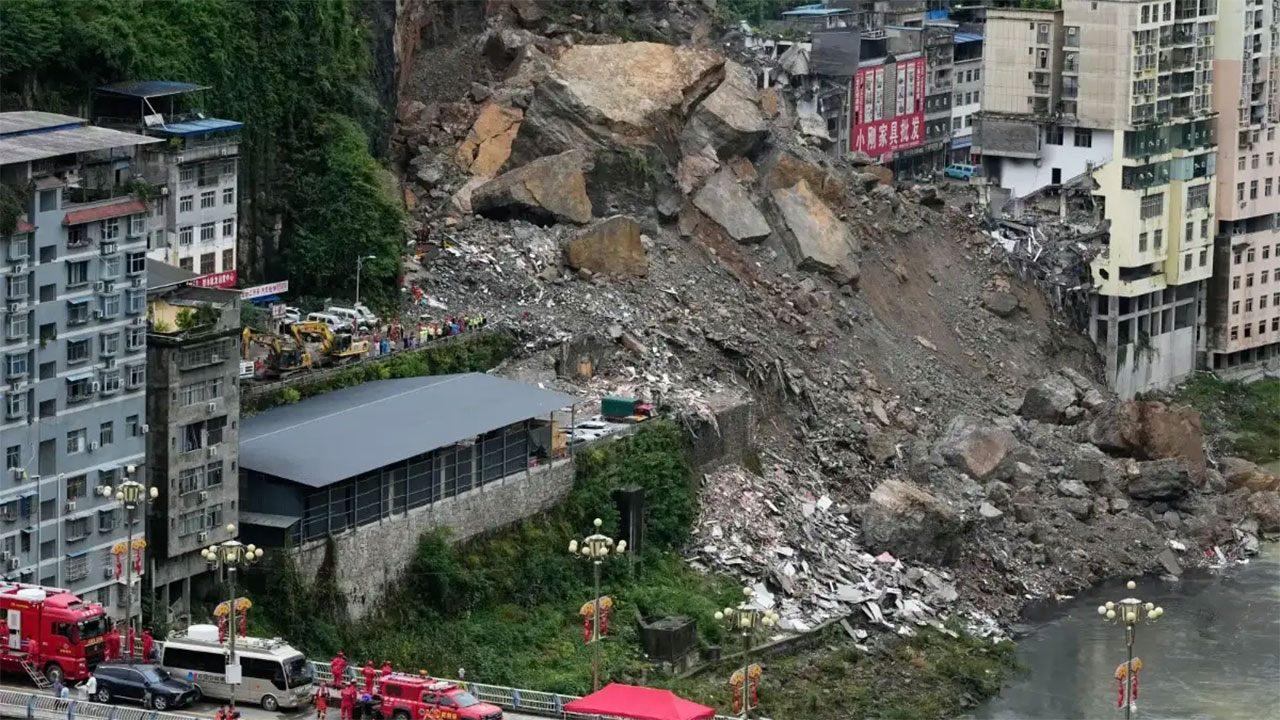 Rescuers race to find survivors in the rain after a landslide in China kills at least 8
