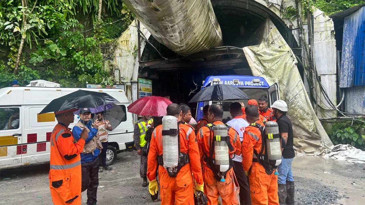 Toxic gas slows efforts to rescue 13 workers trapped in India hydropower tunnel