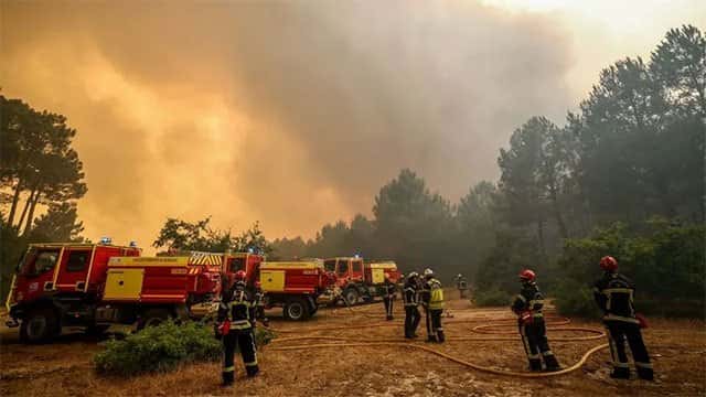 Firefighters struggle to contain Madrid wildfires, as more than 160,000 evacuated in France and Spain