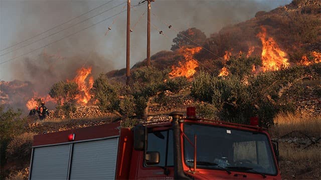 Two firefighters die in Crete as wildfires threaten parts of southern Europe