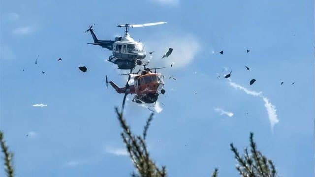 Two crew killed after firefighting helicopters collide in Greece, as British pilot survives