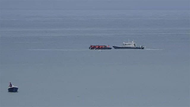 More than 150 migrants rescued after boat catches fire in English Channel