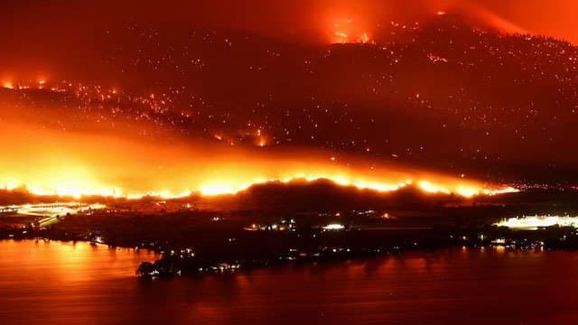 State of emergency declared as fast-moving Canada wildfire doubles in size