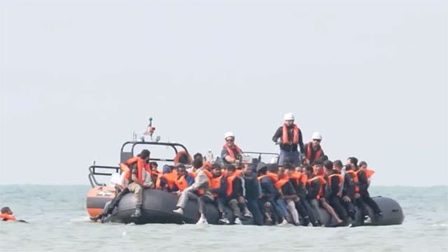 Record 230 migrants reach UK after crossing English Channel in inflatable 'mega-dinghy'