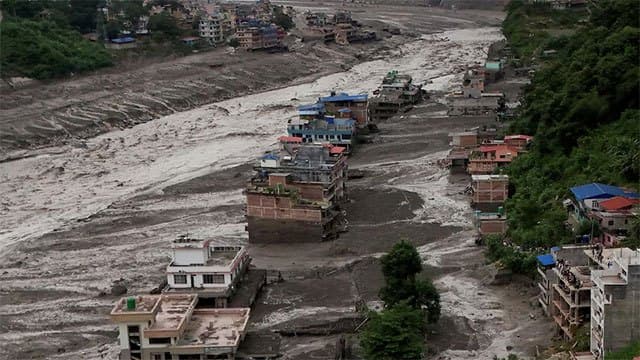 Debris in river could cause further flash flooding, report says
